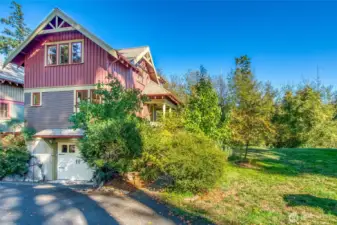 In addition to the attached garage, parking includes a designated parking space, and guest parking spaces on the paved surface of Bright Water Ln.