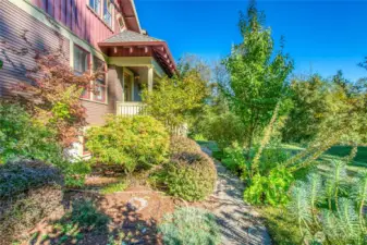Mature landscaping surrounding the flagstone path, complete with drip irrigation, welcomes you home.