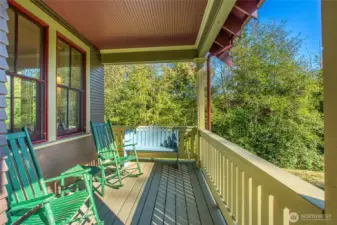 The covered porch let's you enjoy the outdoors in any season.