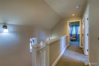 The open hallway leads to the bathroom and the largest bedroom. ther is a full sized washer and dryer conveniently located in the hallway behind a door.