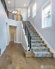 Light filled entry. There is also a custom entry rug (not pictured) that will stay.