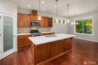 Warm Caraway cabinetry to entertain in this chefs kitchen!
