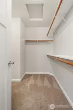 Walk in closet for primary bedroom.