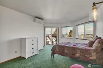 The primary suite is very large, has its own ensuite bathroom that had been remodeled in the past, plus access to the deck. The minisplit allows for zone-type heating and cooling. Very efficient!