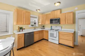 Large kitchen with eating area and direct access to the large back deck and peaceful backyard