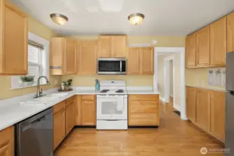 Large kitchen with eating area and direct access to the large back deck and peaceful backyard