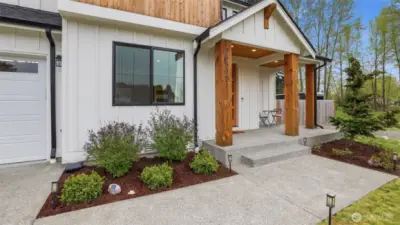 Exposed wood beams and oversized entry door from the front patio.