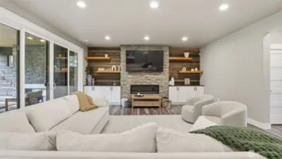 Living room has space for a large, oversized couch, perfect for movie nights or game days!