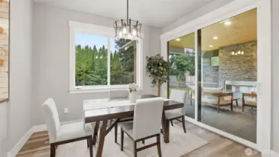 Formal dining area with access to outdoor patio.
