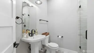 Main floor bathroom that includes a shower. Perfect for main level living and multi-generational living!