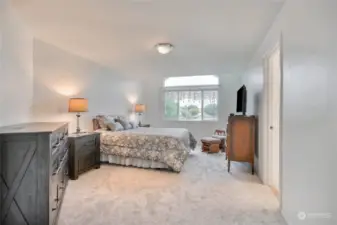 Spacious primary bedroom w/ sitting area. Gorgeous Mt. Rainier views from the window