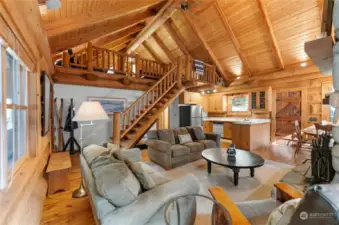 Main floor living room with open kitchen and dinning area