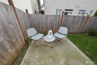 Cozy back patio for cookouts and relaxing.