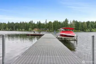 This is a gorgeous dock which will give you years of enjoyment.  The dock material is fiberglass grating with stainless steel hold down clips and lag bolts.