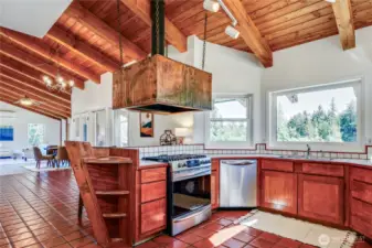 Kitchen with large copper hood - brand new propane range