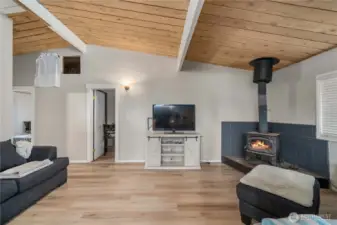 Living room with vaulted ceiling.
