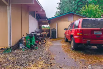 Rear 2 car detached garage with shop space.