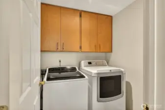 Utility room includes washer and dryer