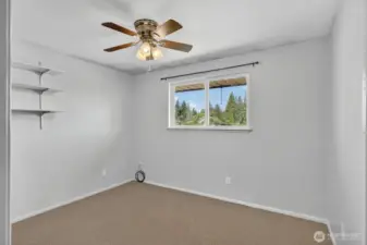 Office den with ceiling fan