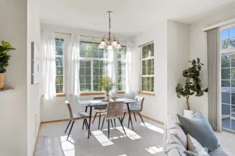 Spacious dining area surrounded by natural light.
