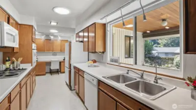 Enjoy backyard views while prepping meals in this sun-filled kitchen.