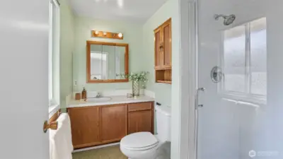 Enjoy the convenience of a private bath with vanity storage and walk-in shower.