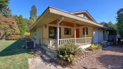 Enjoy this charming covered patio spot to sip coffee or unwind outdoors.