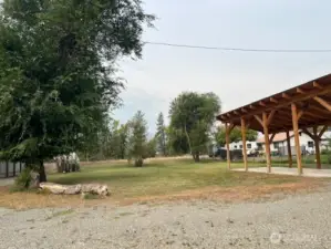 Gravel driveway and landscaped with aspen trees