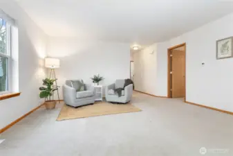 Front room is spacious with space for a piano or extra work area or informal and formal seating.