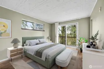 Main floor Primary bedroom with doors out to the wrap around deck. Wake up and have your cup of joe out on your deck  while listening to birds and the sounds of nature.- virtually staged