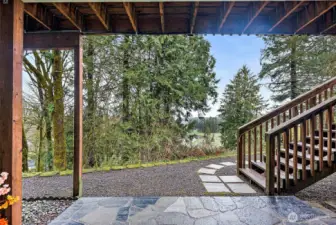 Downstairs patio and wow, look at this view! Head down the stone pavers over to the large firepit, or head on up to the deck above