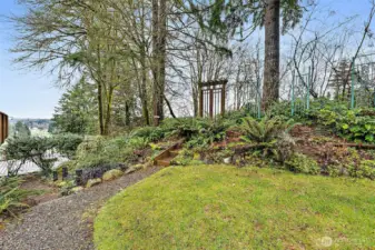 As you venture around the outdoors, you will see more signs of the unique character of this property, including pathways that lead to your garden decor throughout.