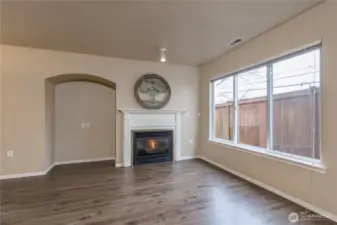 Big bright windows and a cozy fireplace in the living room