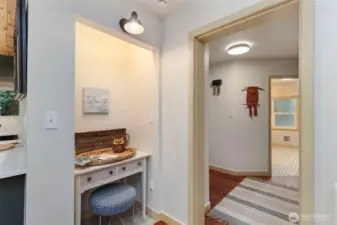 Cherry and tile floors, chunky painted trim, built in storage around every corner.