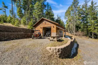 Rustic cabin and garage combo offering privacy, space, and mountain lifestyle living.
