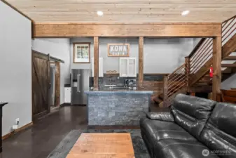 Spacious great room with modern rustic finishes and open layout.