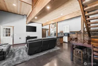 Spacious great room with exposed beams and modern rustic design perfect for entertaining