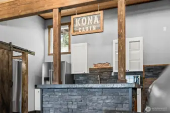 Custom wood accents and bar area creating a true cabin retreat atmosphere.