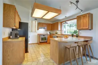 Open kitchen with lots of cabinet and counter space.  Garden window overlooks the peaceful backyard!