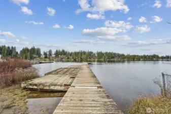 Community lake dock for enjoying fishing, paddle-boarding, and kayaking.