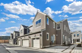 Back of home with one car garage