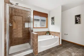 5-piece primary bath with tile surround shower plus soaking tub.