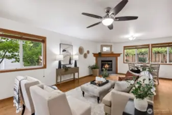 Wood wrapped windows and laminate flooring downstairs.