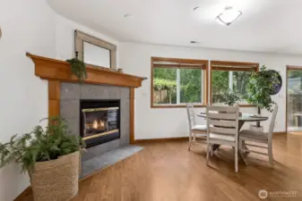 Cozy gas fireplace off family room.