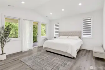 Primary suite features luxurious ensuite bath, walk in closet + private balcony