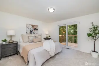 Primary bedroom with direct deck access.