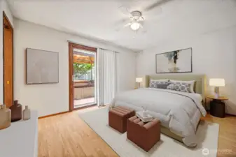 Virtually Staged. Expansive primary suite with a private ensuite bathroom and plenty of space for a king bed and additional furnishings. A sliding glass door opens to the backyard hot tub, creating a seamless indoor-outdoor retreat.