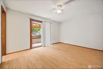 Spacious primary retreat with direct access to the backyard deck — your own private escape just steps from the hot tub.
