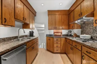 Stainless steel appliances with ample storage for cookware and pantry items