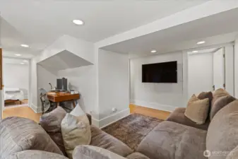 Finished basement with separate entry, featuring bedroom, living area, and flex space. Ideal for guests!